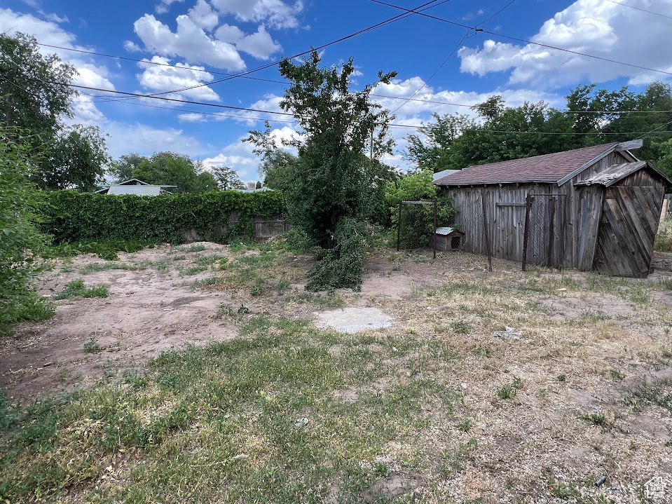 View of yard with a shed