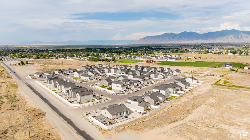 Aerial perspective of suburban area with a mountainous background