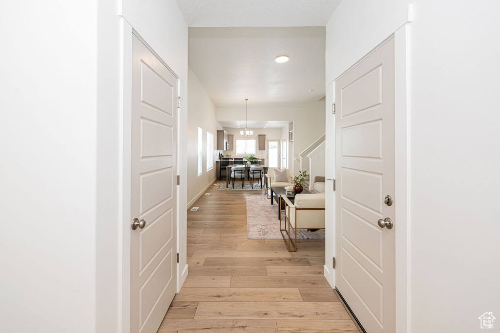 Entryway featuring light wood finished floors and recessed lighting