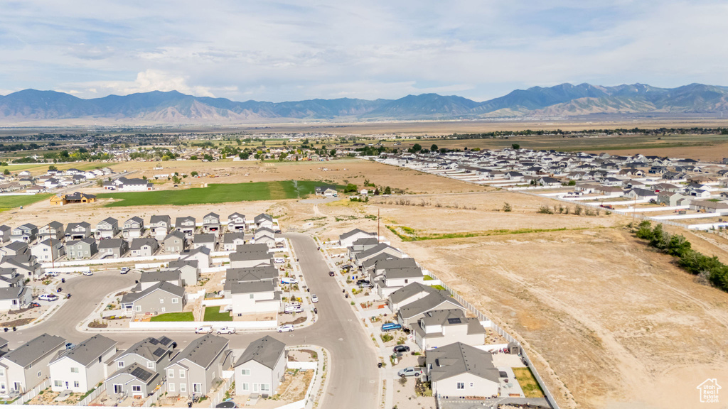 Aerial view of residential area featuring a mountainous background
