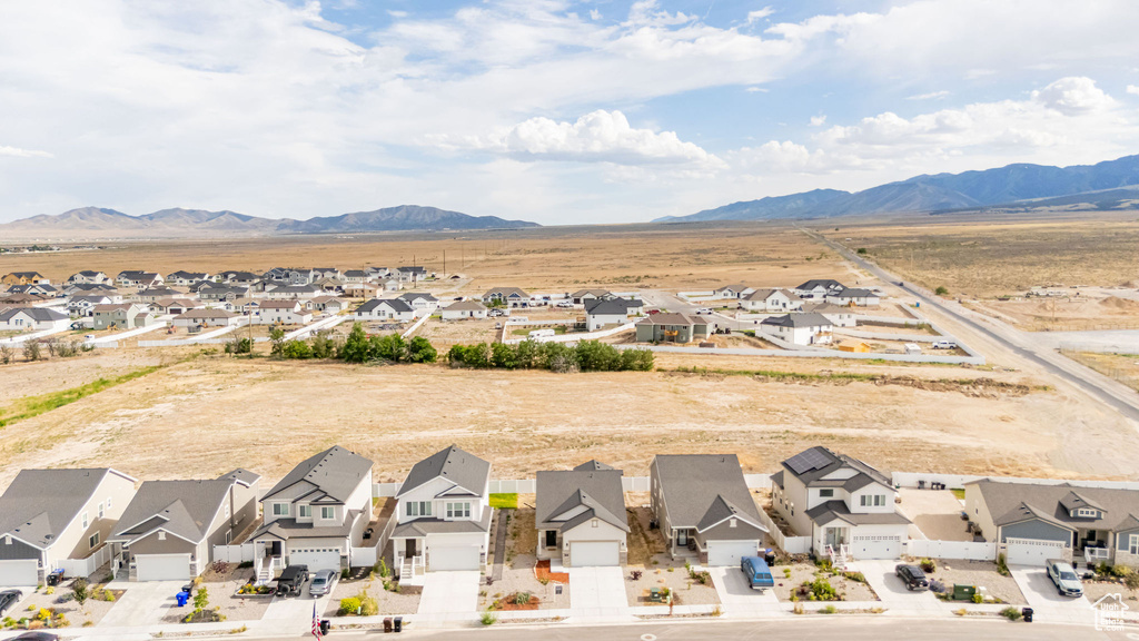 Aerial perspective of suburban area with a mountain backdrop