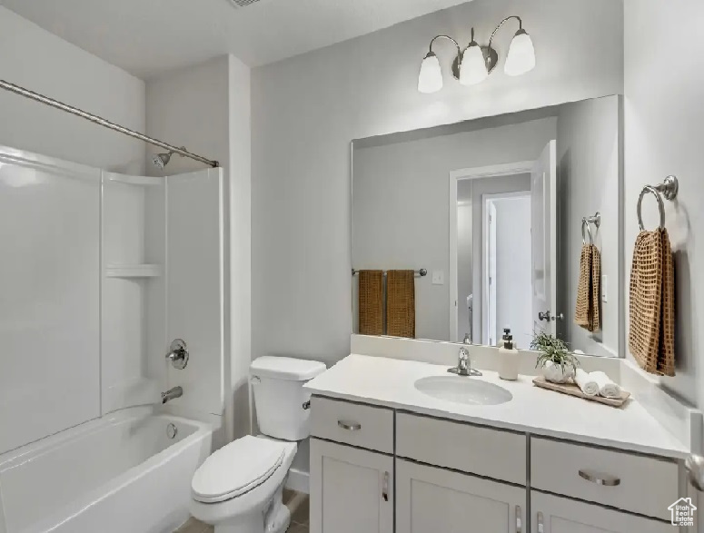 Bathroom with vanity and tub / shower combination