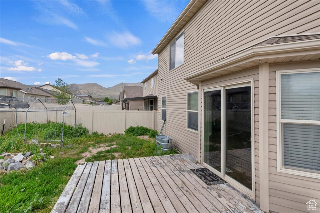 Wooden deck featuring a mountain view