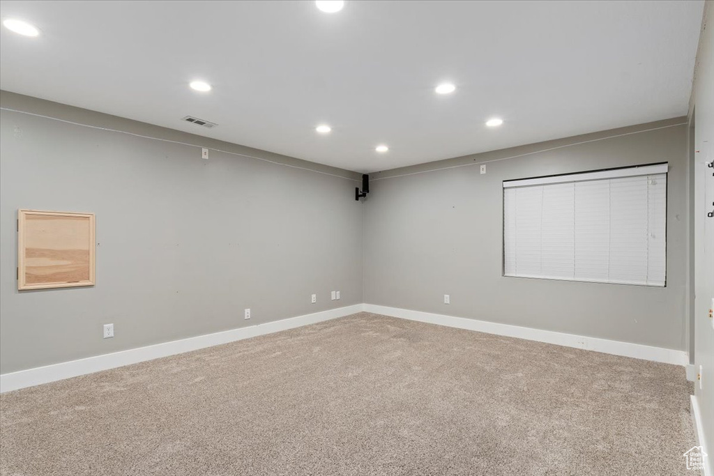 Unfurnished room featuring recessed lighting and carpet floors