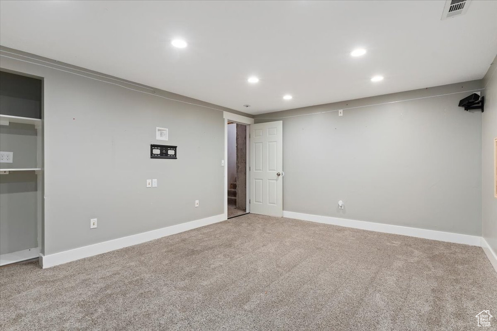 Finished basement featuring recessed lighting and carpet floors