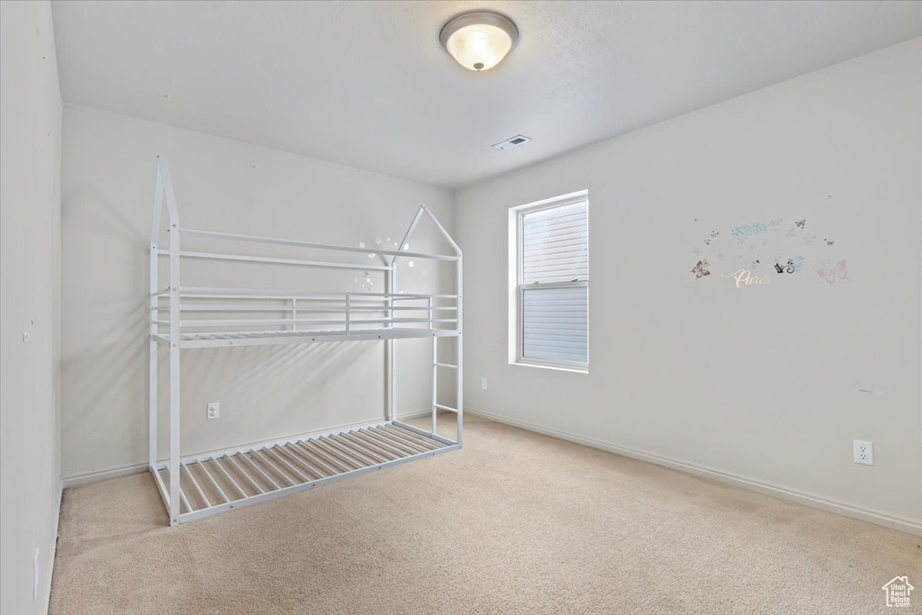 Unfurnished bedroom with carpet flooring