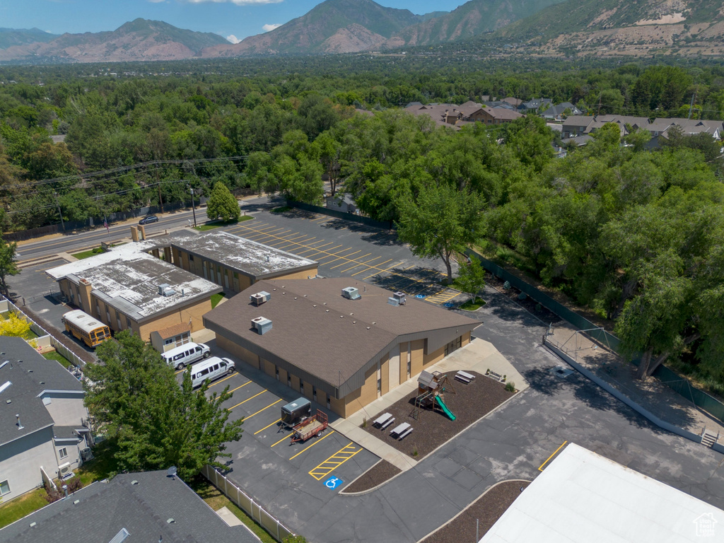 Drone / aerial view of mountains and a heavily wooded area