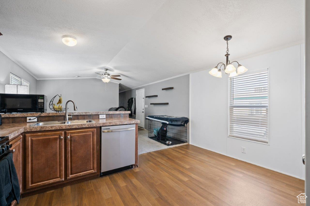 Kitchen featuring stainless steel dishwasher, black microwave, ceiling fan, a chandelier, and ornamental molding