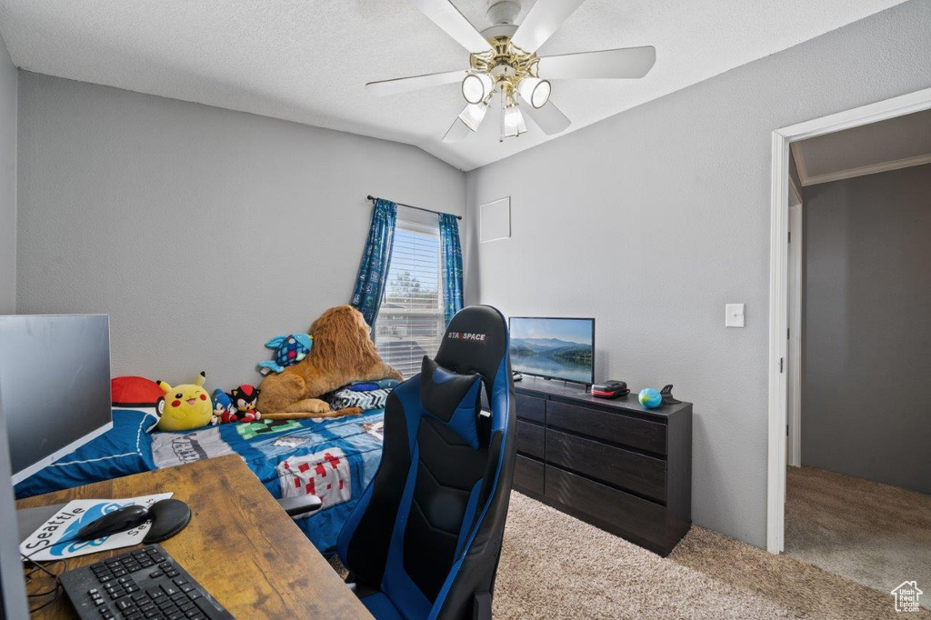 Carpeted bedroom featuring ceiling fan