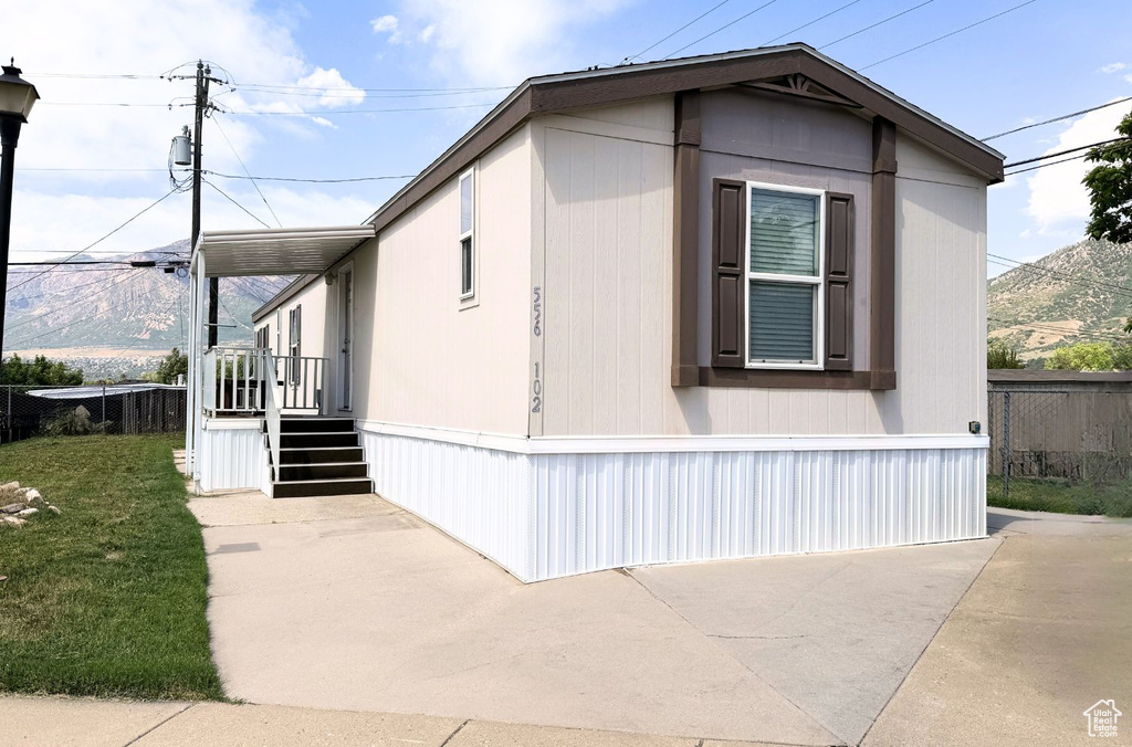 View of side of property with a patio area