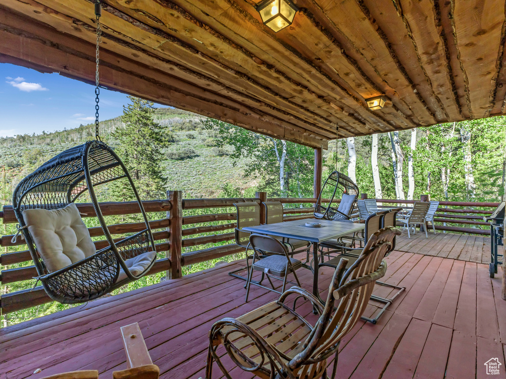 Wooden terrace featuring outdoor dining space