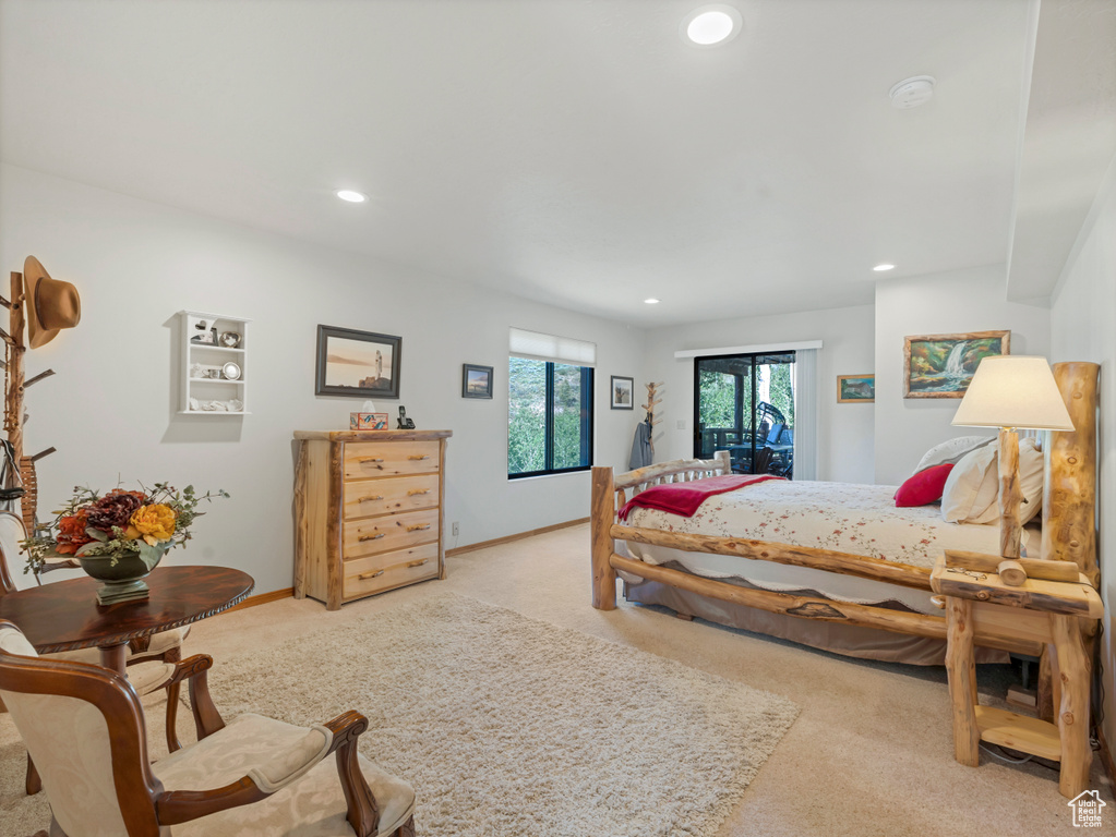 Bedroom featuring light carpet and recessed lighting