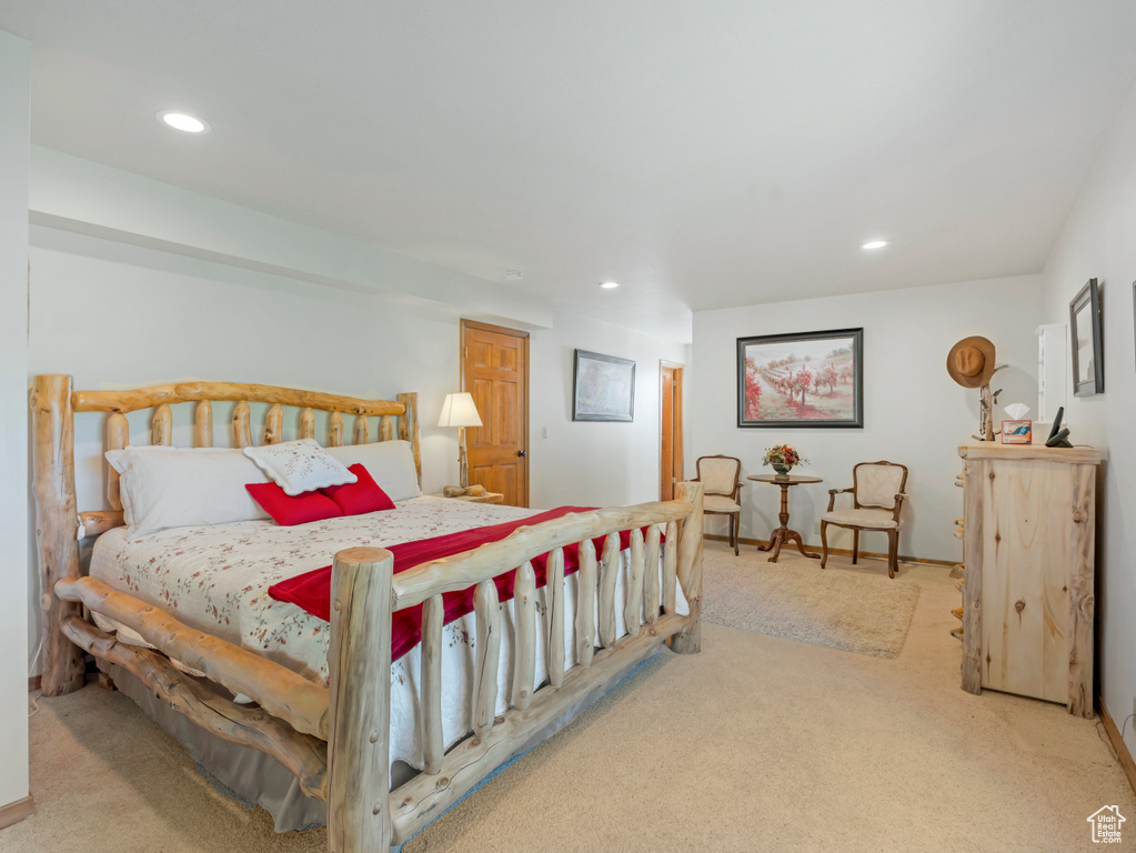 Carpeted bedroom with recessed lighting