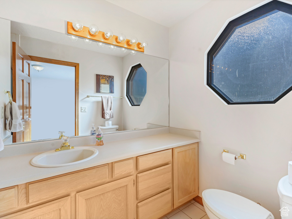 Bathroom with vanity and tile patterned floors