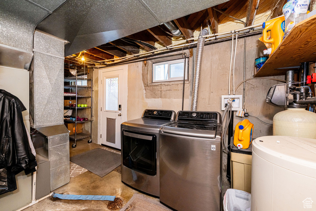 Washroom featuring washing machine and clothes dryer