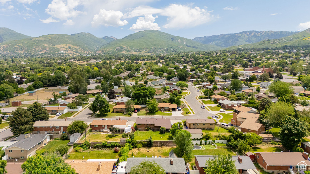 Aerial perspective of suburban area featuring a mountain backdrop