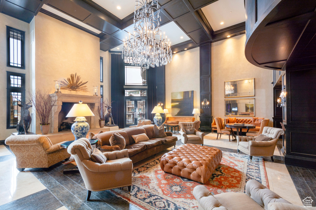 Building lobby with a high ceiling, coffered ceiling, and beam ceiling