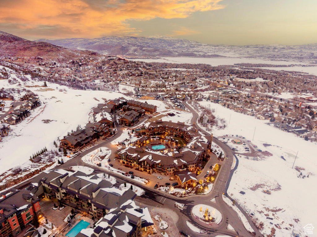 Snowy aerial view featuring a mountain view