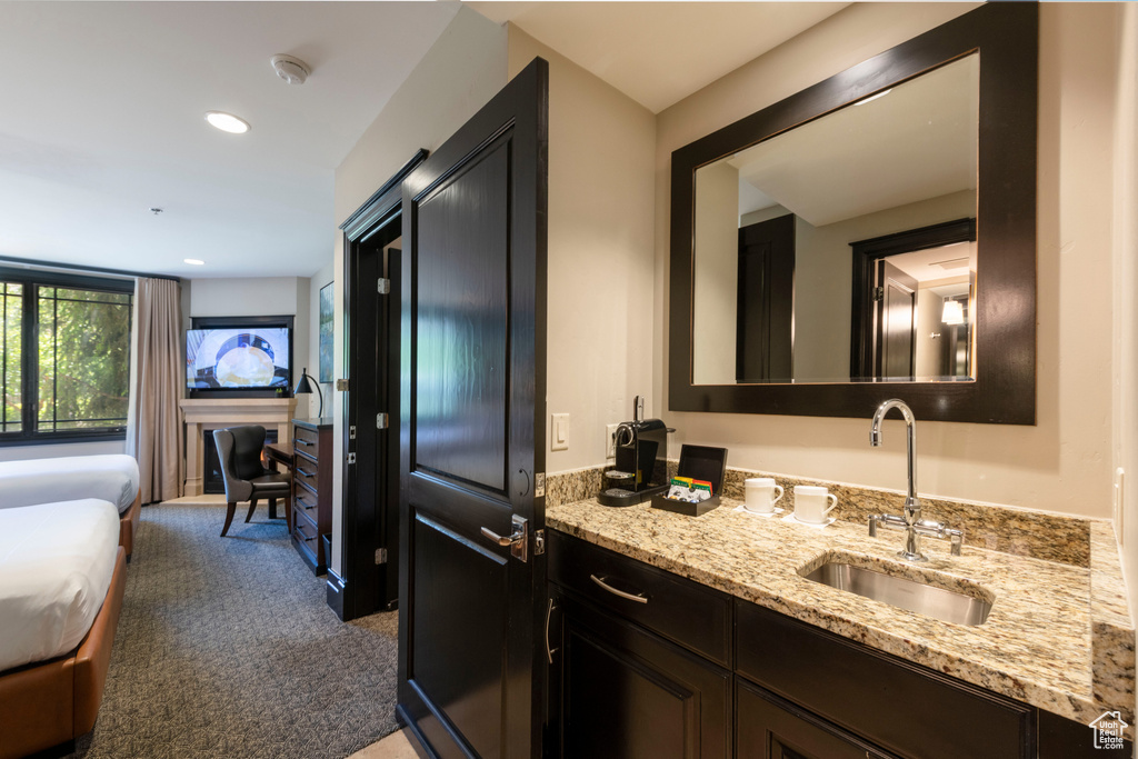 Ensuite bathroom featuring vanity and recessed lighting