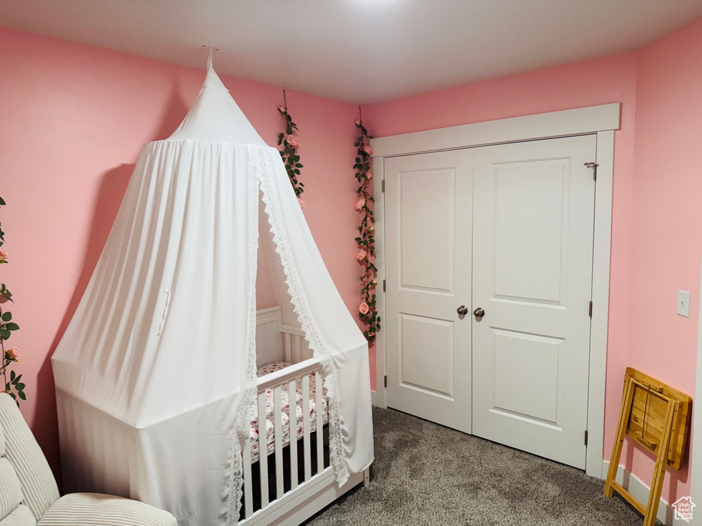 Bedroom featuring carpet floors and a closet