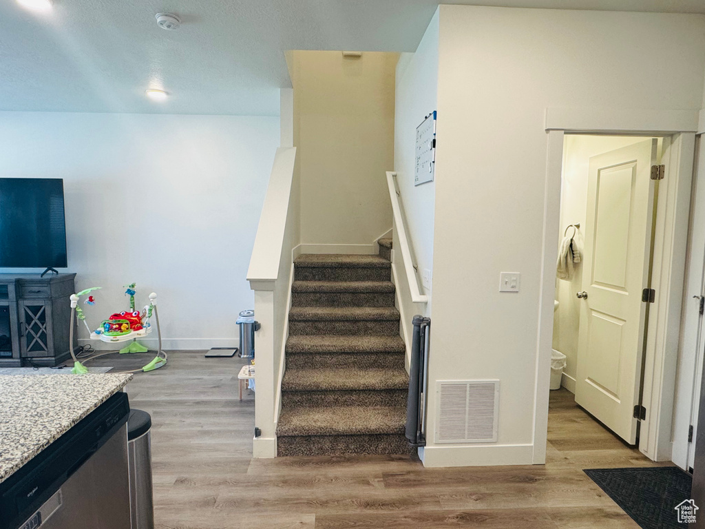 Stairway with wood finished floors