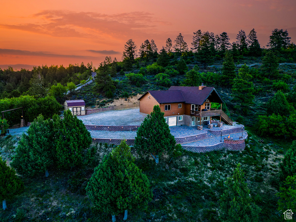 View from above of property featuring a heavily wooded area