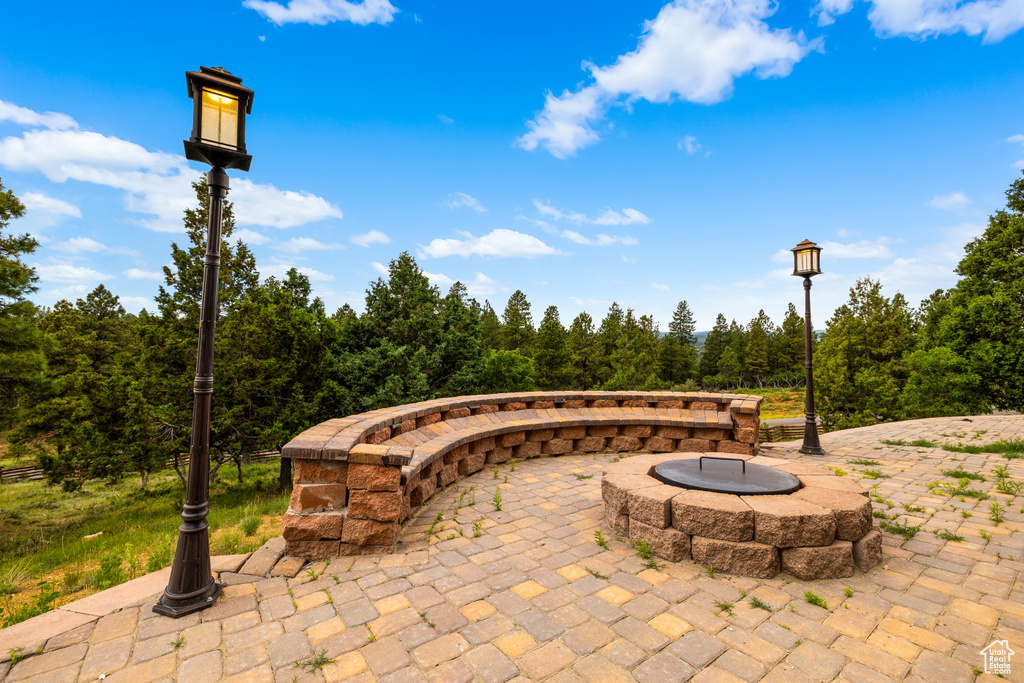 View of patio featuring a fire pit