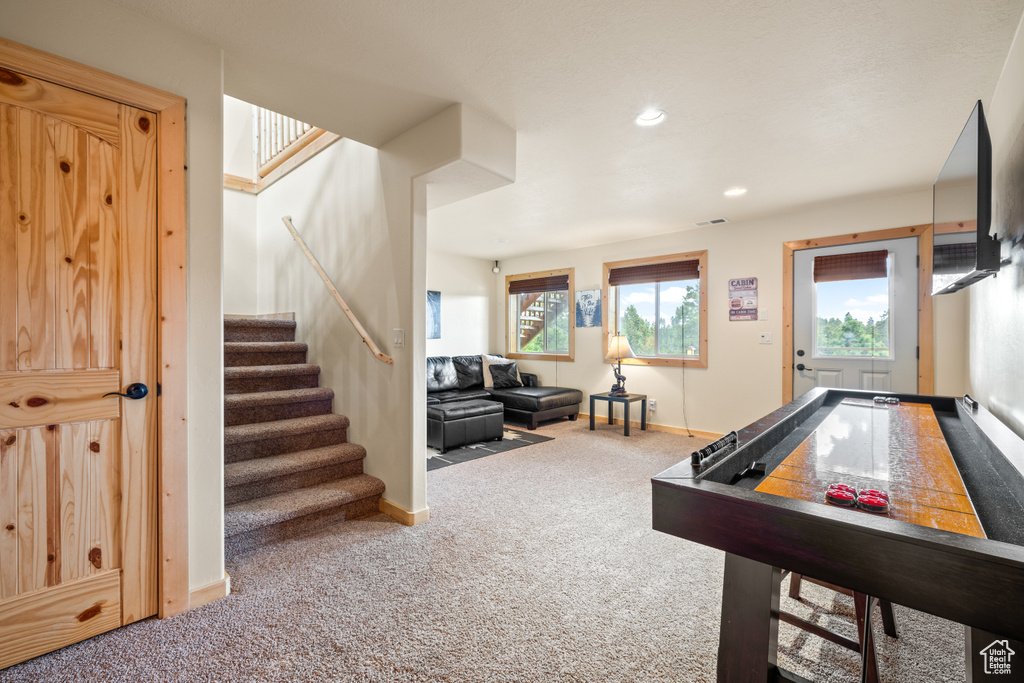 Game room with carpet flooring and recessed lighting