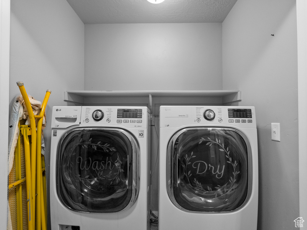 Washroom with washing machine and dryer