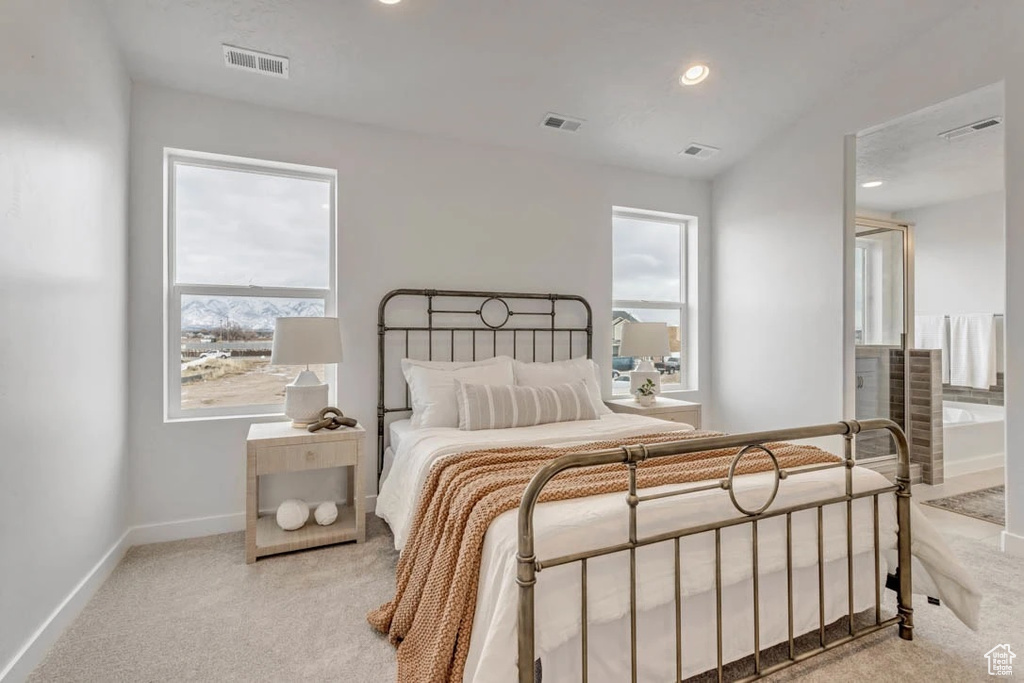 Carpeted bedroom with baseboards and recessed lighting
