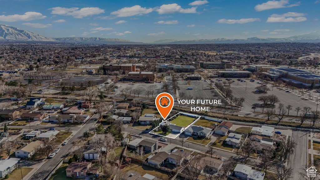 Aerial overview of property's location with a mountainous background