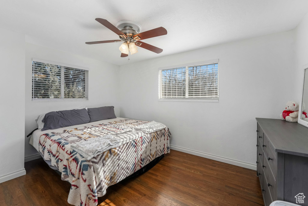 Bedroom with wood finished floors and a ceiling fan