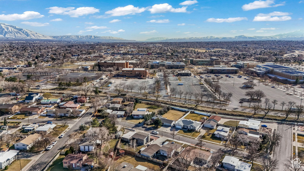 Aerial view of property's location with a mountain backdrop