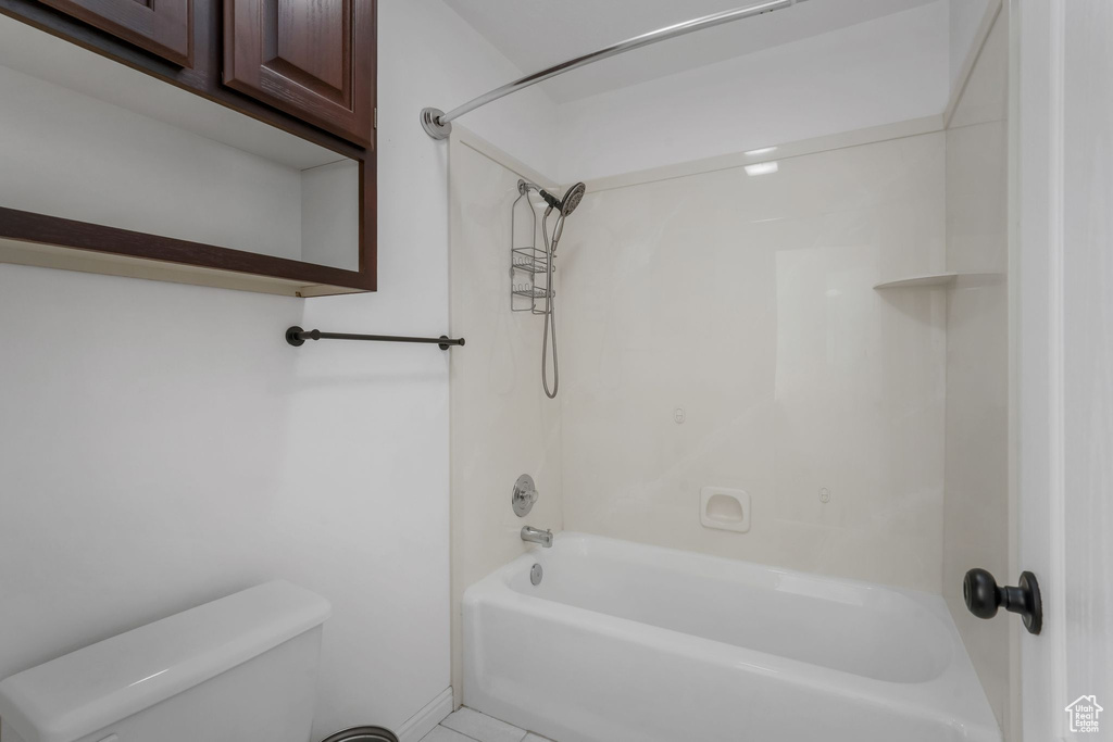 Bathroom with toilet and bathing tub / shower combination