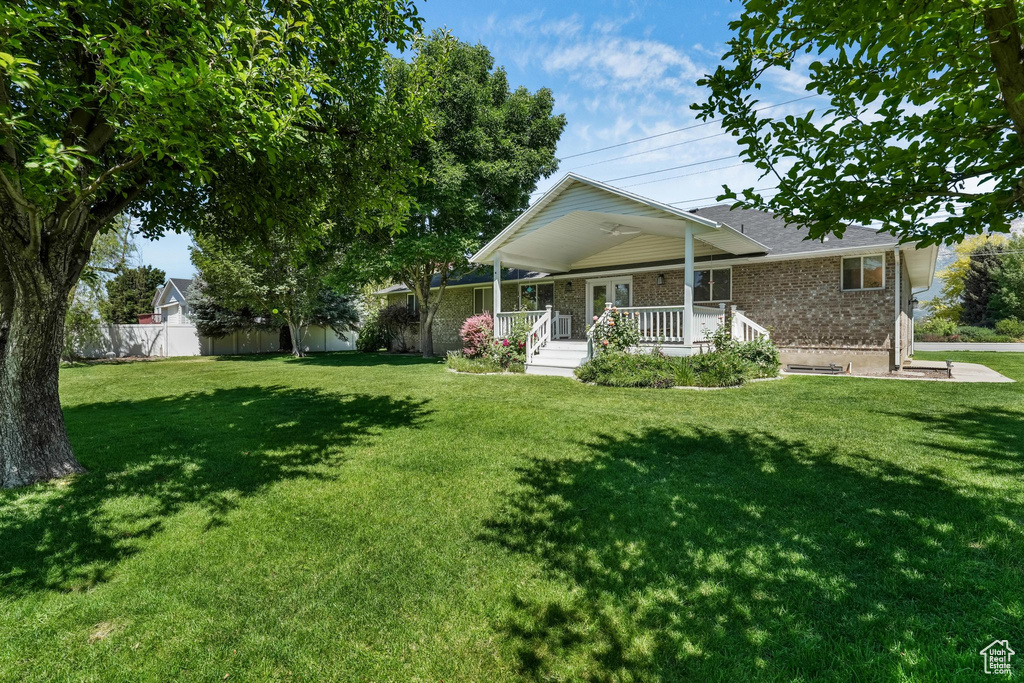 View of front of house with brick siding and covered porch
