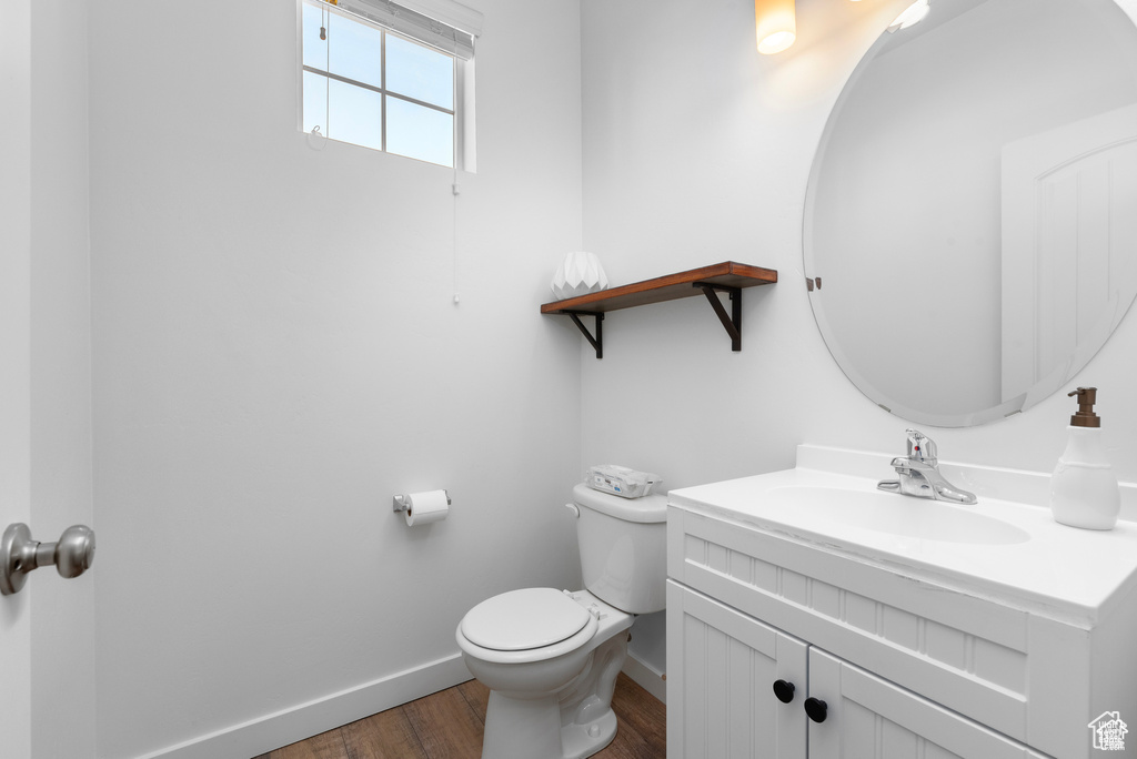 Bathroom featuring vanity and wood finished floors