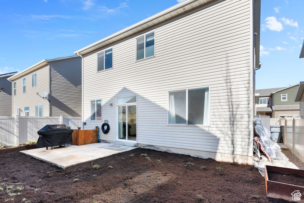 Back of house featuring a patio area and a fenced backyard