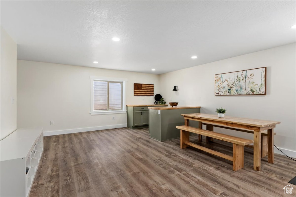 Dining space featuring wood finished floors and recessed lighting