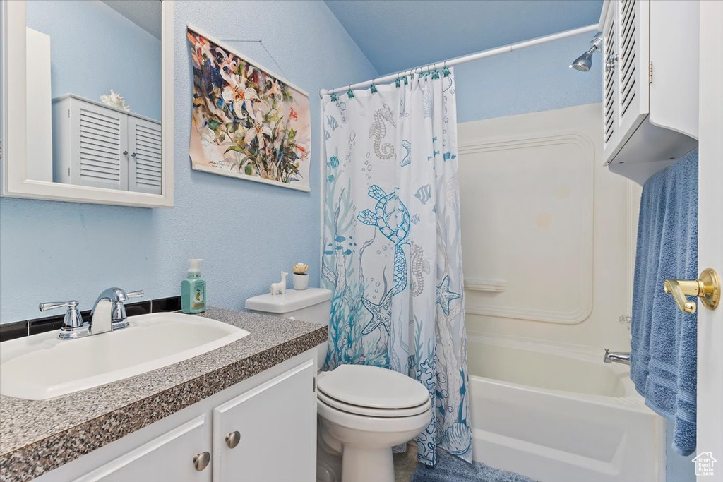Full bathroom with vanity and shower / tub combo with curtain
