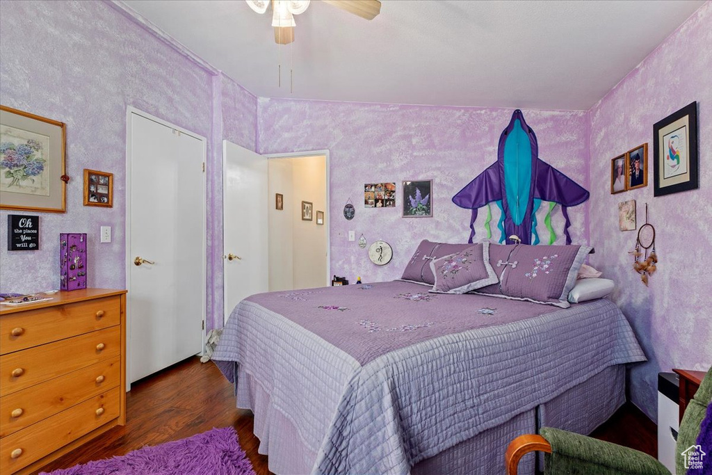 Bedroom featuring wood finished floors and ceiling fan