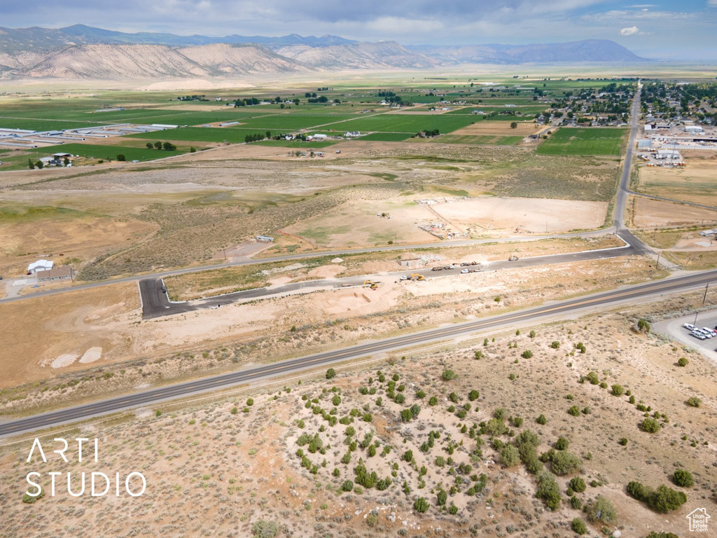 Aerial view of sparsely populated area featuring a mountainous background