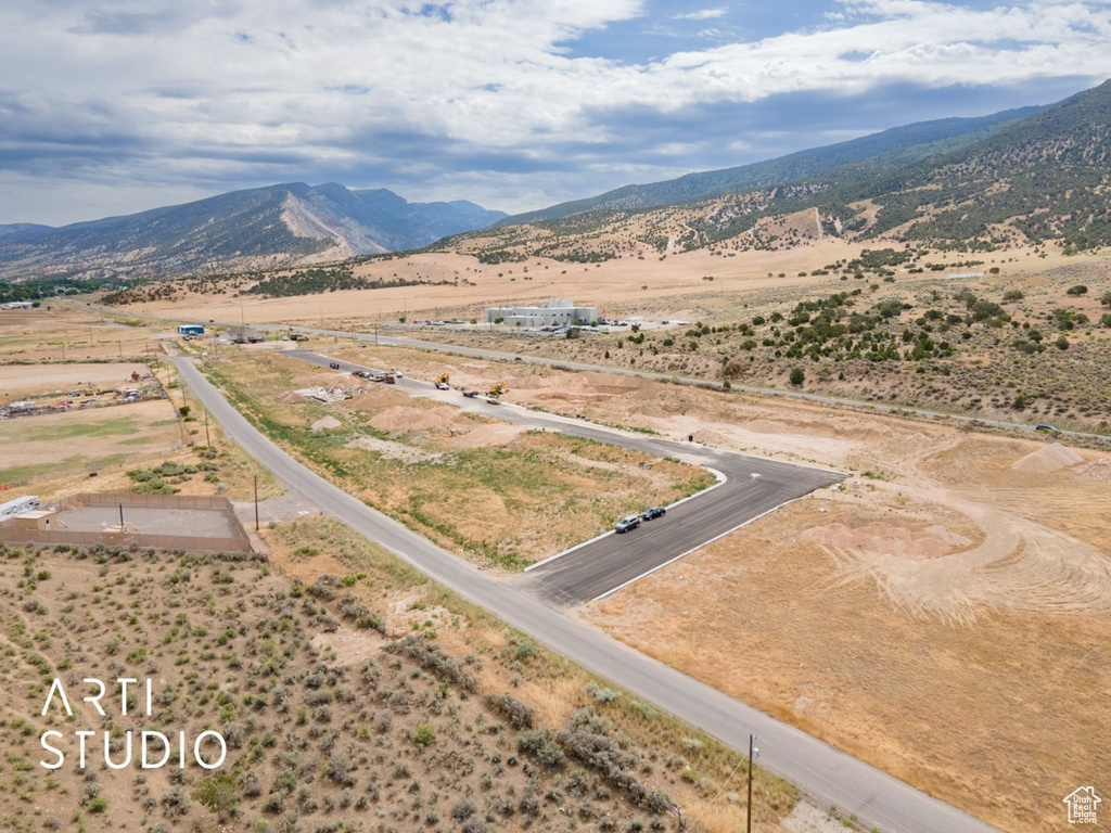 Aerial view of sparsely populated area featuring a mountainous background