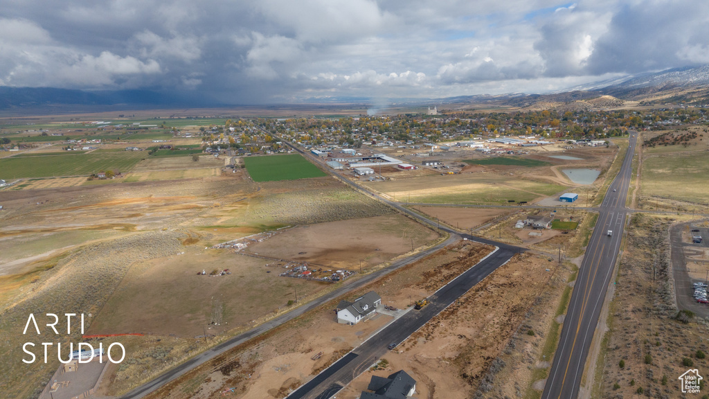 Aerial view of property's location with a mountainous background