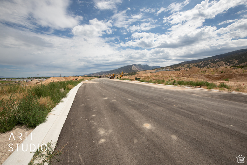 View of asphalt street with a mountain view