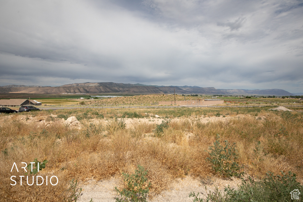 View of mountain backdrop featuring rural landscape
