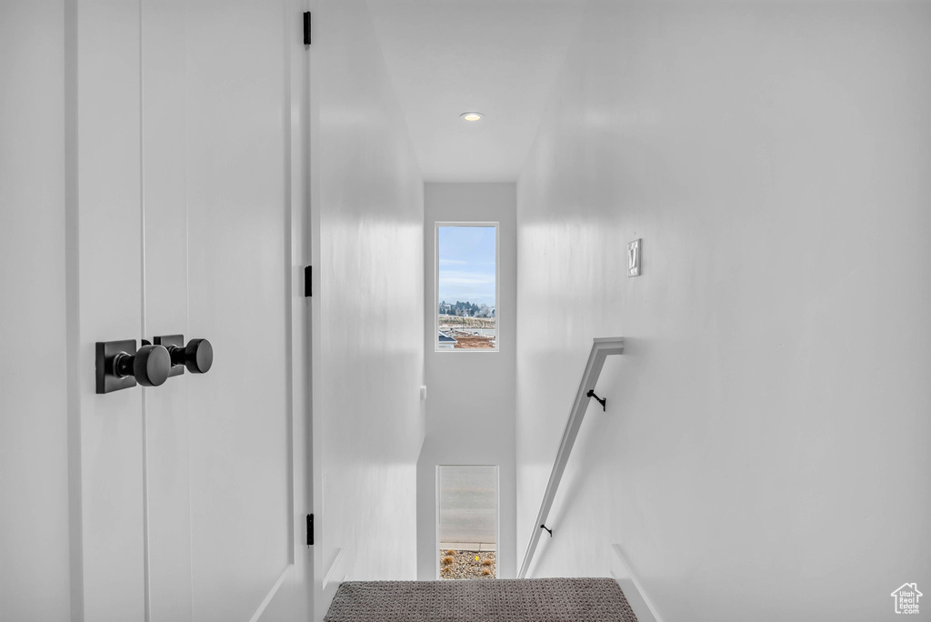 Staircase featuring recessed lighting