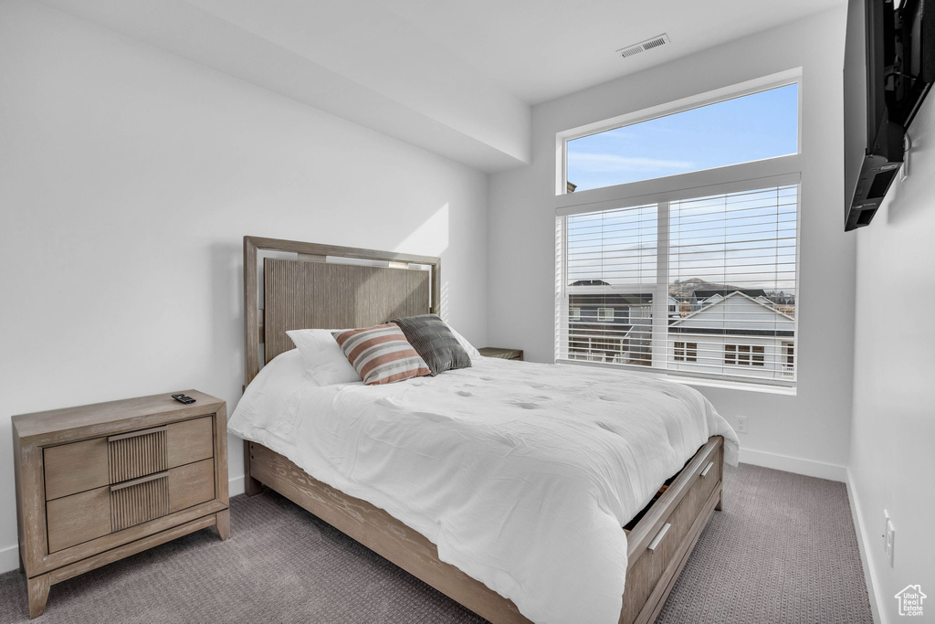 Carpeted bedroom with baseboards