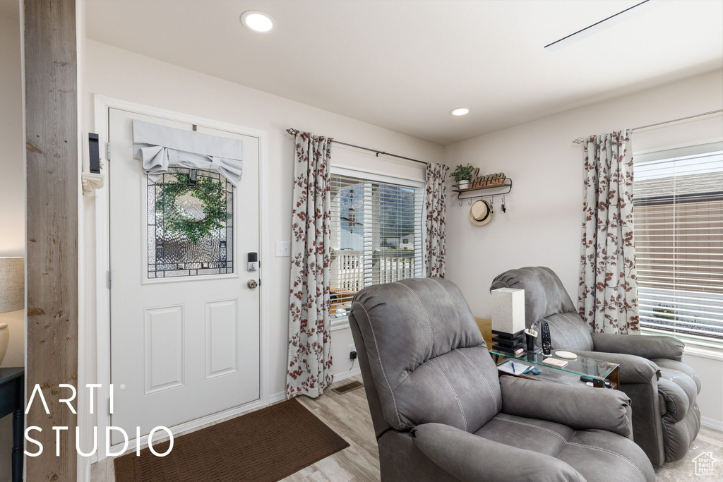 Foyer with plenty of natural light, light wood-style floors, and recessed lighting