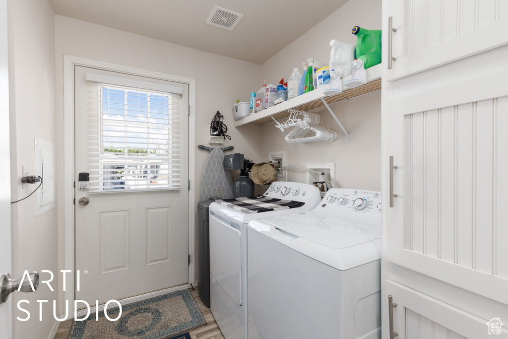 Laundry room with washing machine and dryer