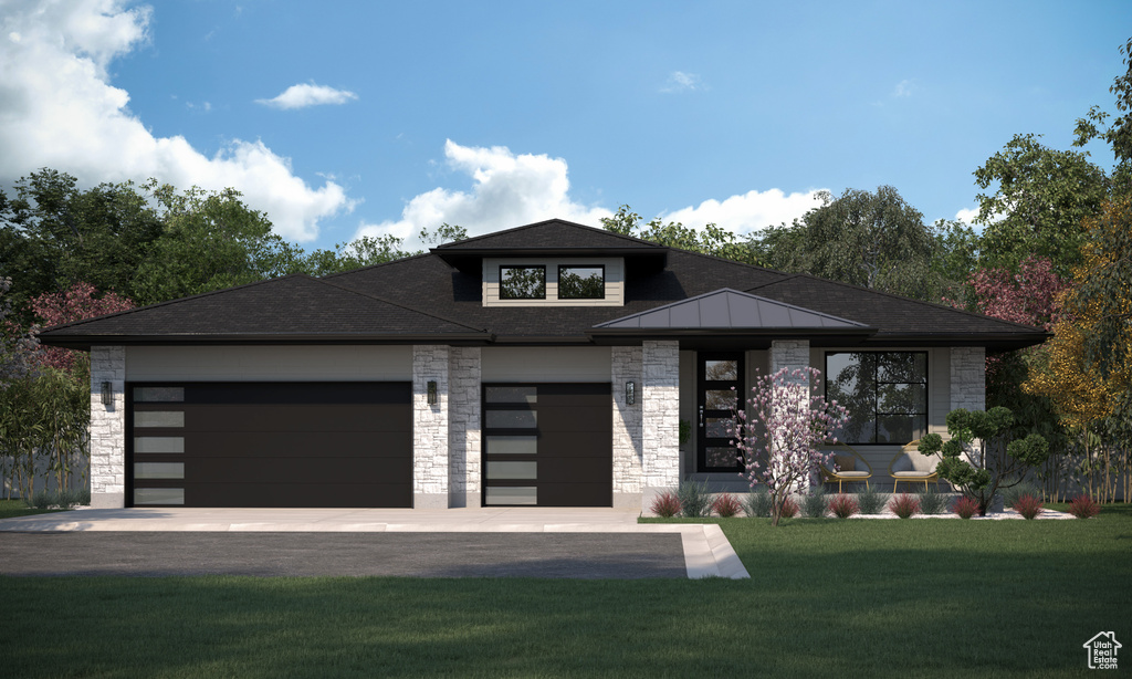 Prairie-style house with stone siding, a front lawn, an attached garage, and roof with shingles